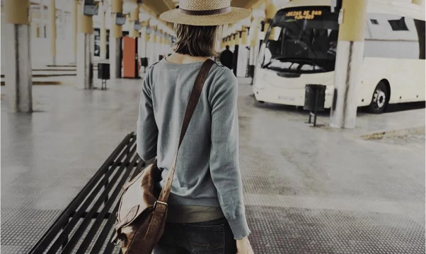 Image of a person at a bus station.